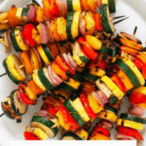 Grilled vegetable skewers on a plate.
