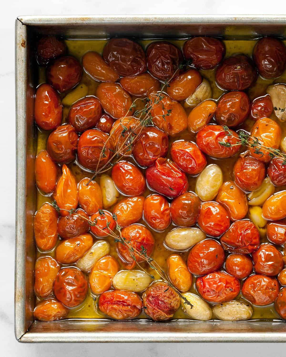 Confit tomatoes in a baking pan.