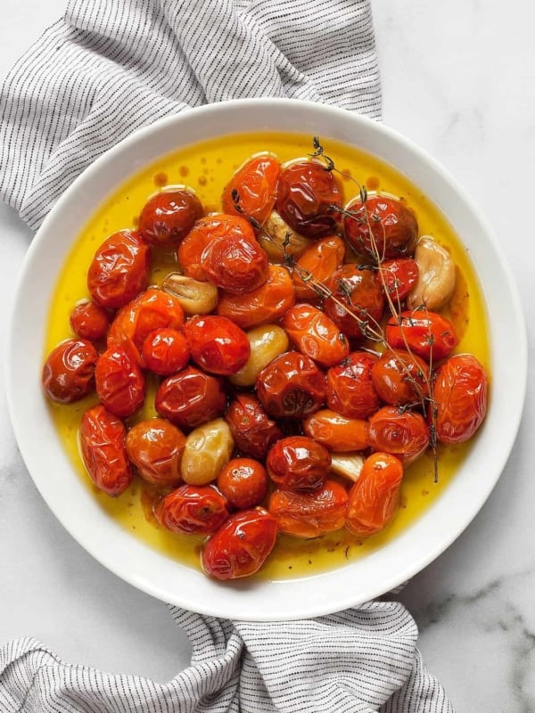 Cherry tomato confit on a plate.