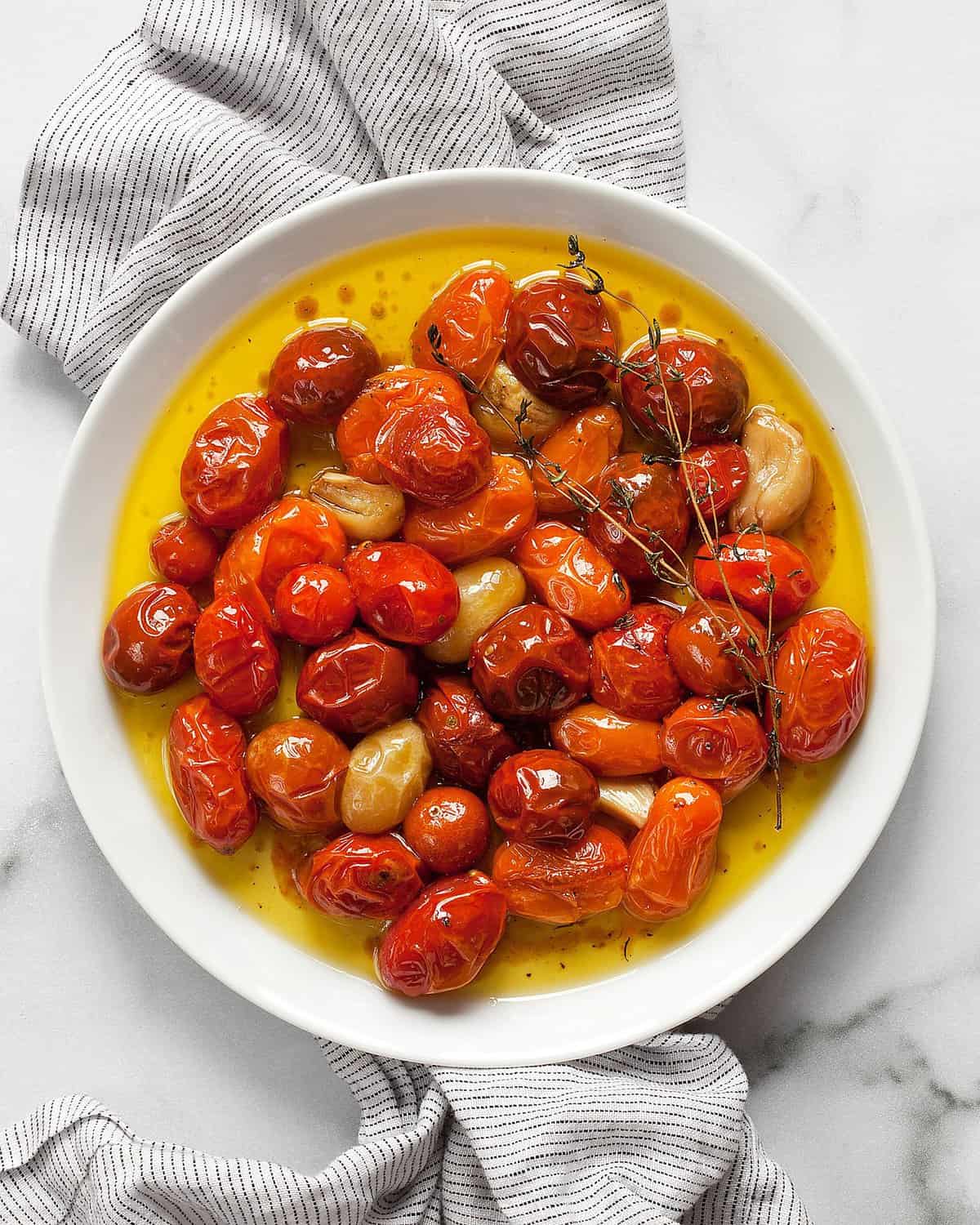 Cherry tomato confit on a plate.