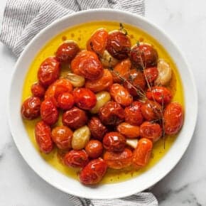 Cherry tomato confit on a plate.