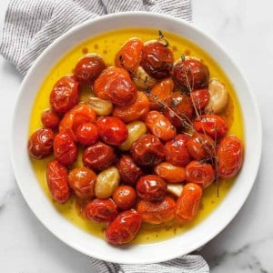 Cherry tomato confit on a plate.
