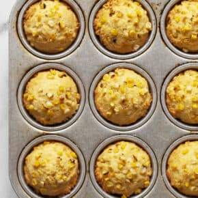 Cornbread muffins in a muffin pan.