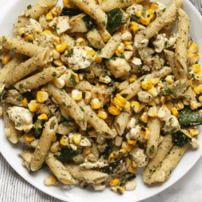 Grilled zucchini corn pasta with mint pesto on a plate.