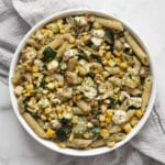 Grilled zucchini corn pasta with mint pesto in a bowl.