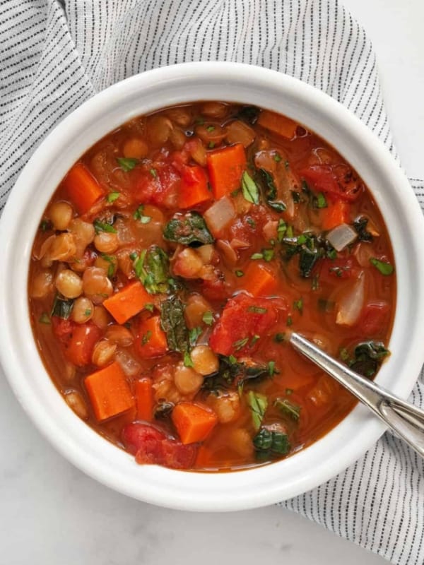 Bowl of tomato carrot lentil soup.