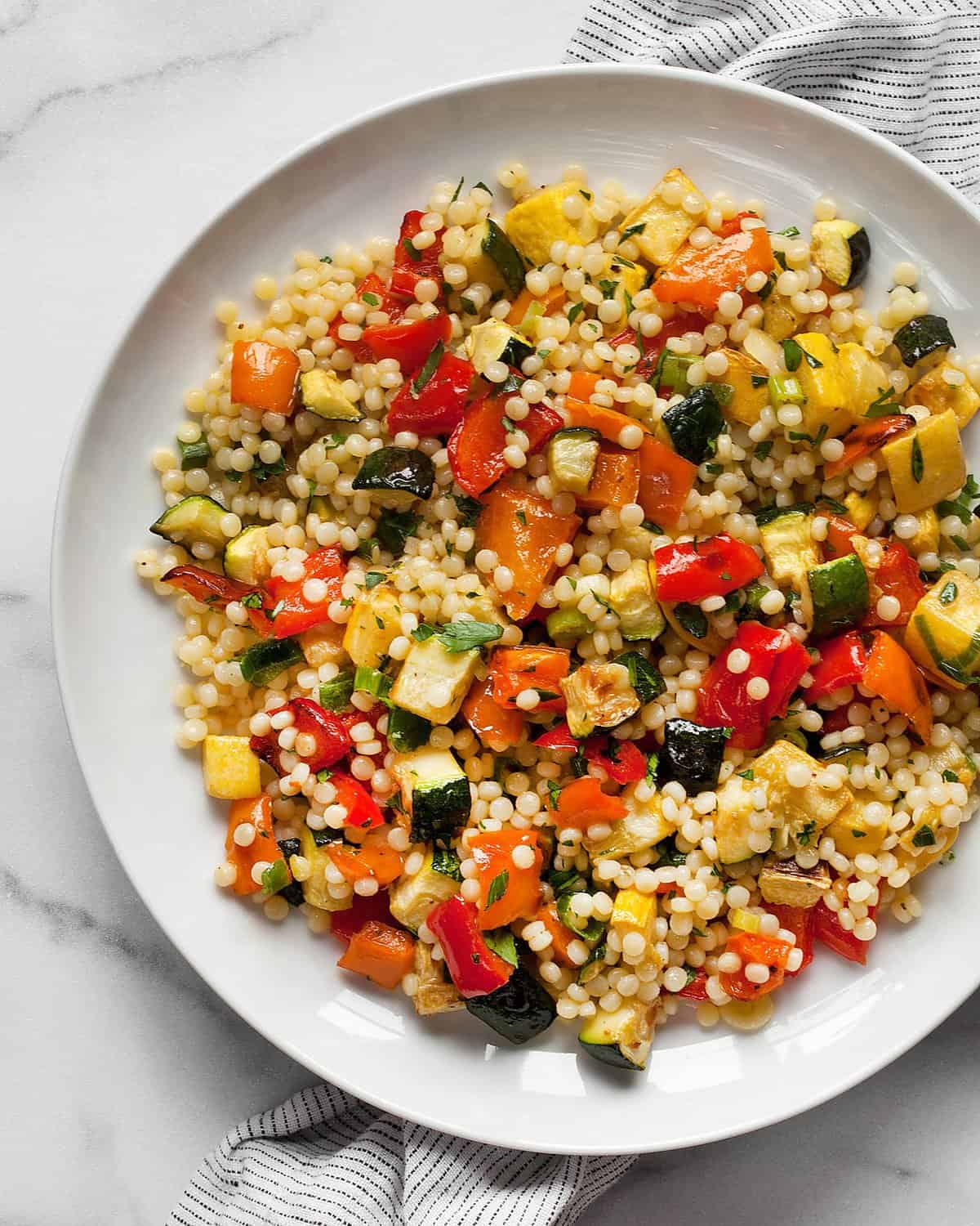 Roasted vegetable couscous on a plate.