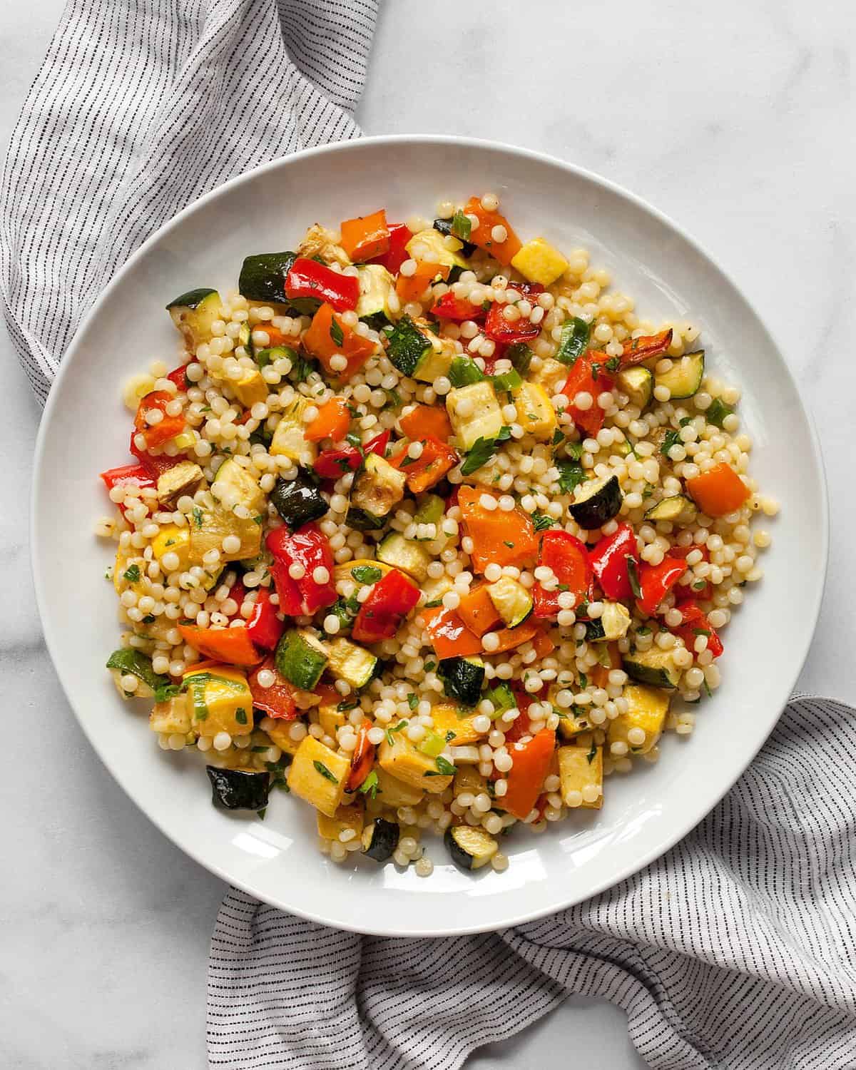 Roasted vegetable couscous on a plate.