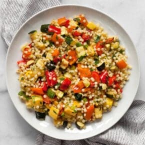 Roasted vegetable couscous on a plate.
