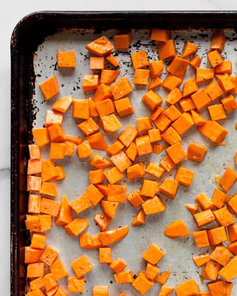 Diced sweet potatoes on sheet pan