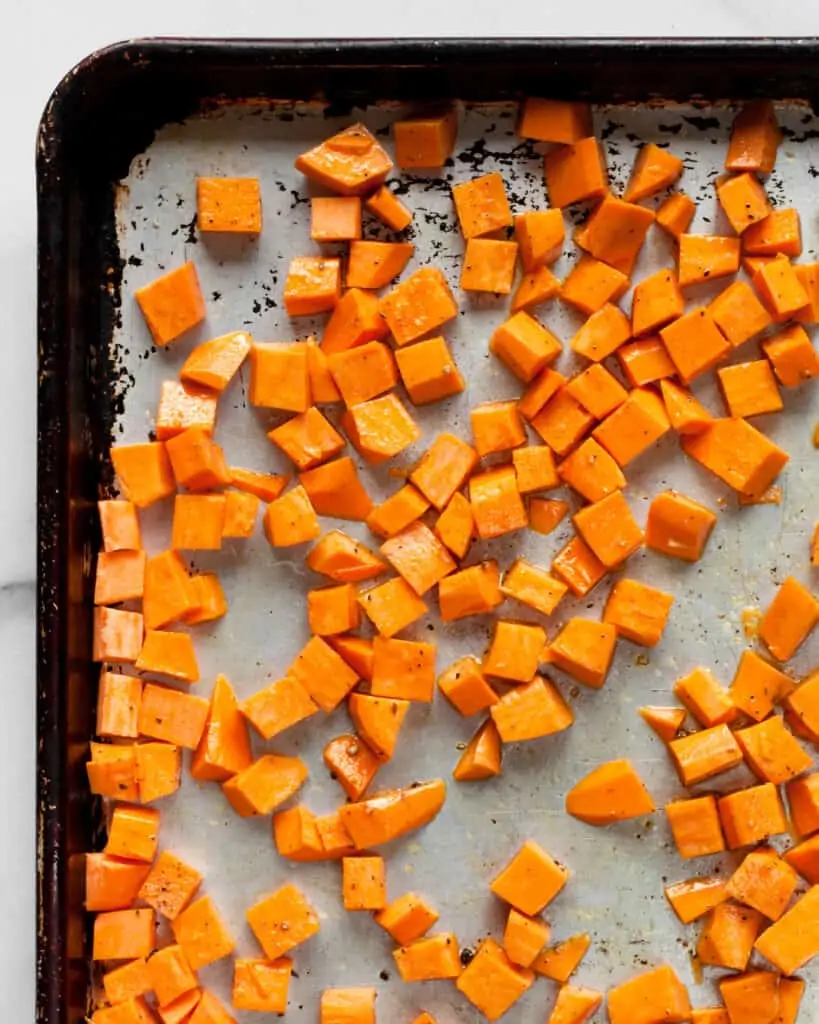 Diced sweet potatoes on sheet pan