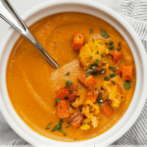 Roasted sweet potato cauliflower soup in a bowl.
