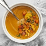 Roasted sweet potato cauliflower soup in a bowl.