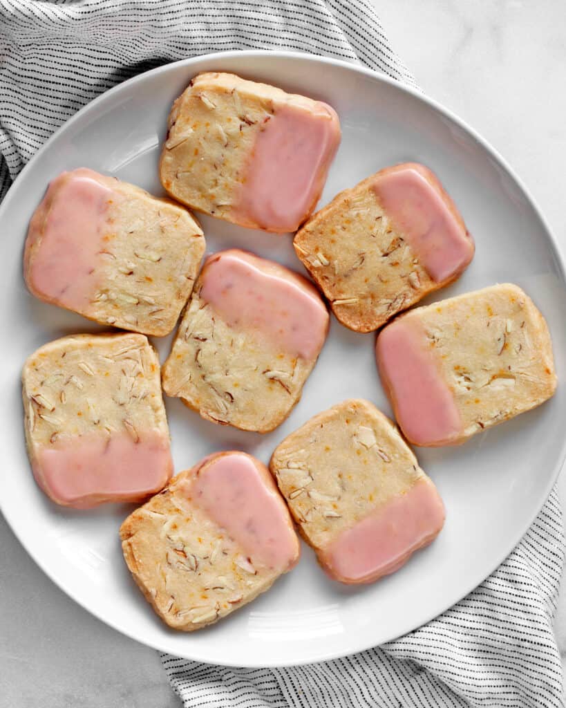 Eight icebox cookies on a plate.