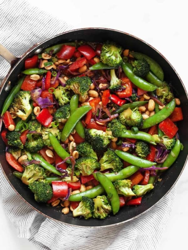 Peanut veggie stir-fry in a skillet.