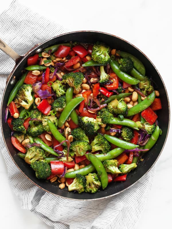 Peanut veggie stir-fry in a skillet.