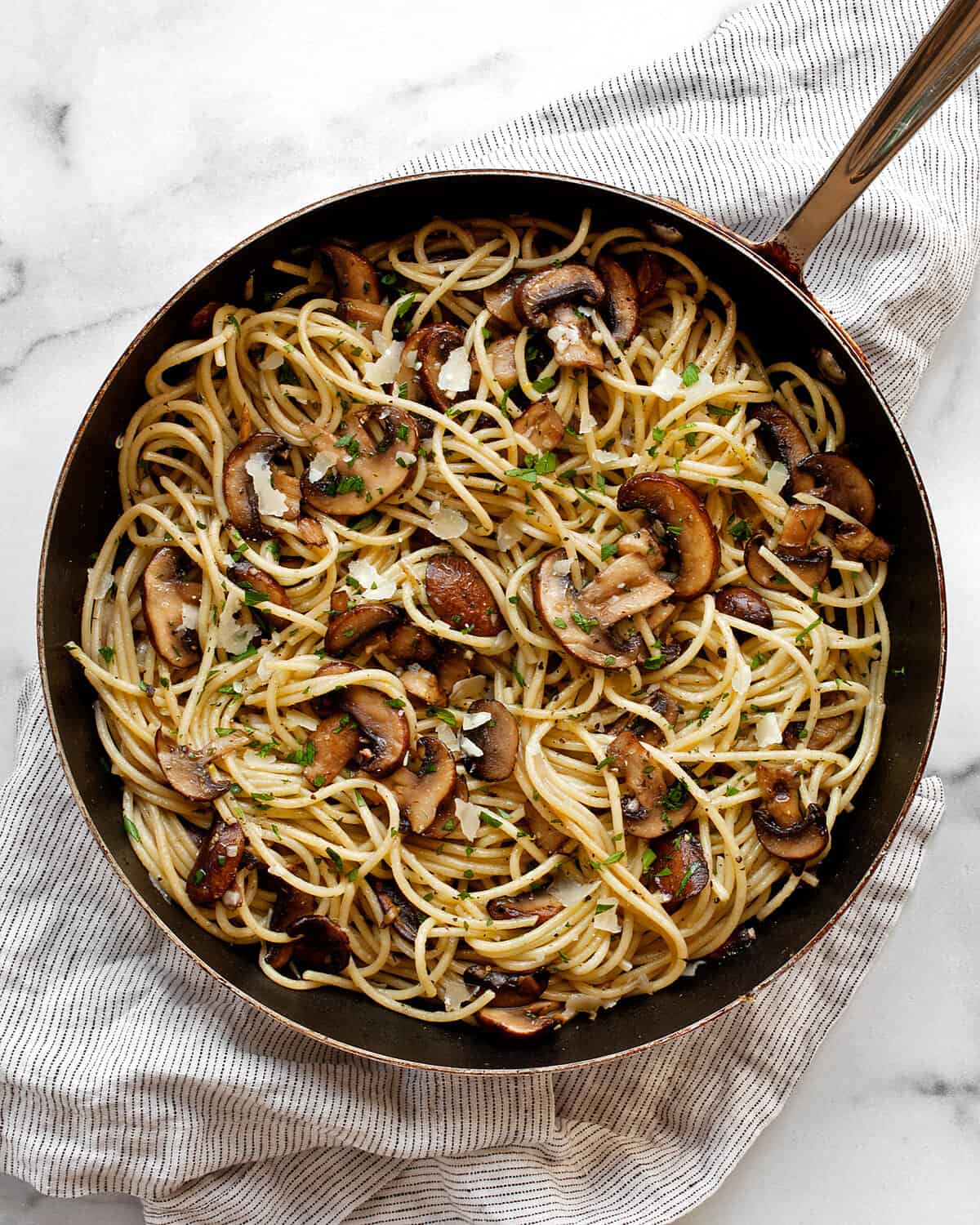 Lemon mushroom spaghetti in a skillet.