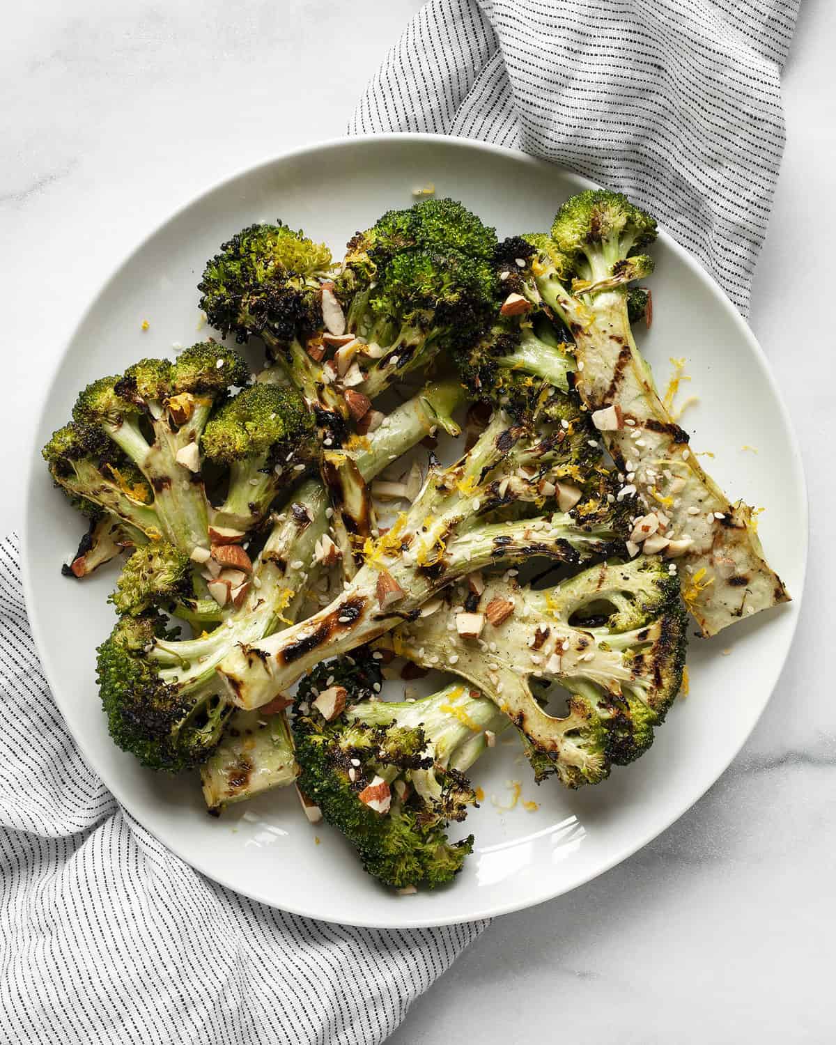 Lemon grilled broccoli on a plate.