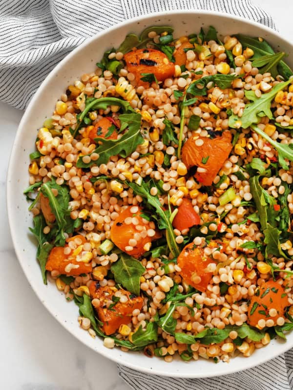 Grilled apricot corn couscous in a bowl.