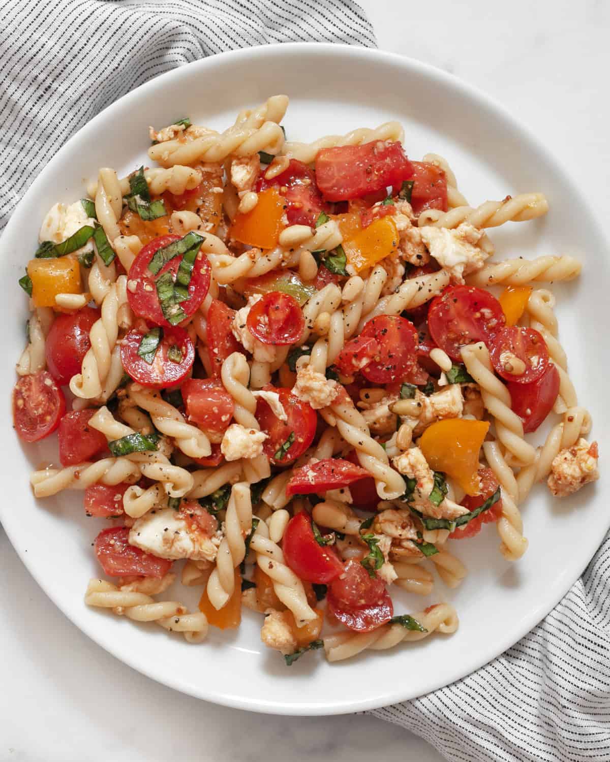 Bruschetta pasta salad on a plate.