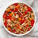 Bruschetta pasta salad in a bowl.