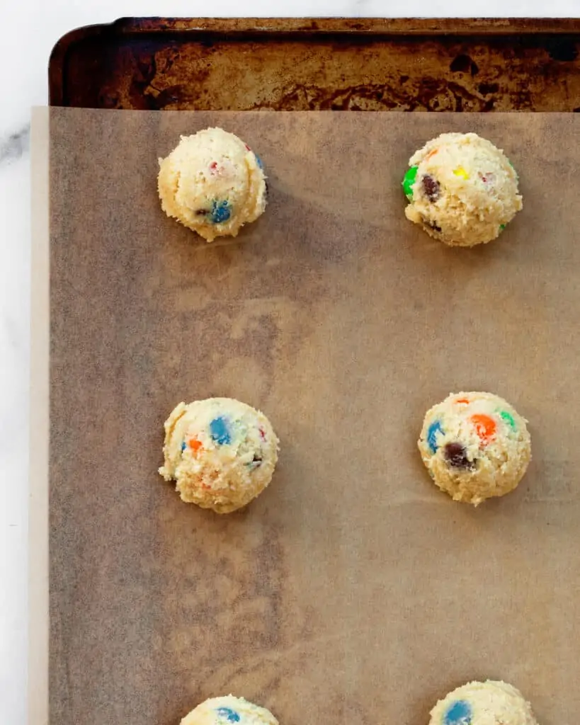 Cookie dough balls on sheet pan