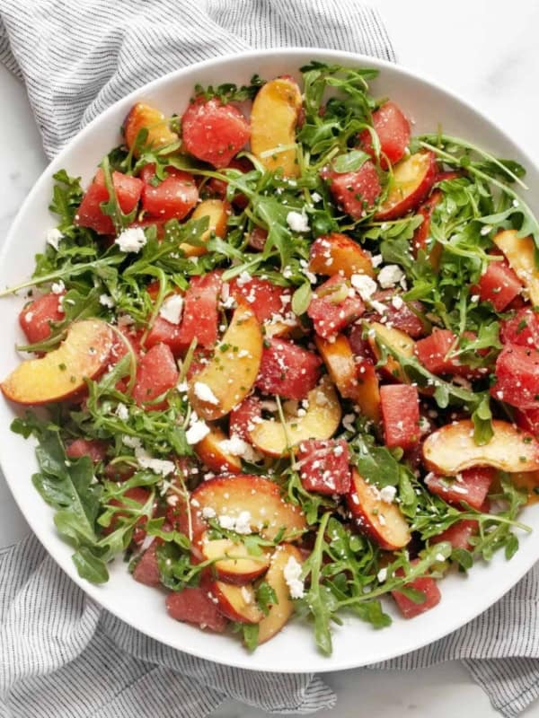 Watermelon peach salad in a bowl.