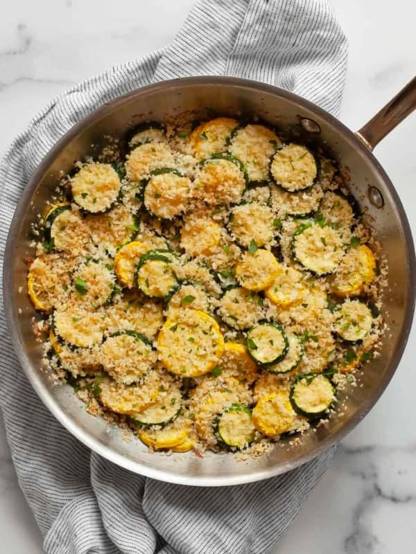 Summer squash casserole in a skillet.