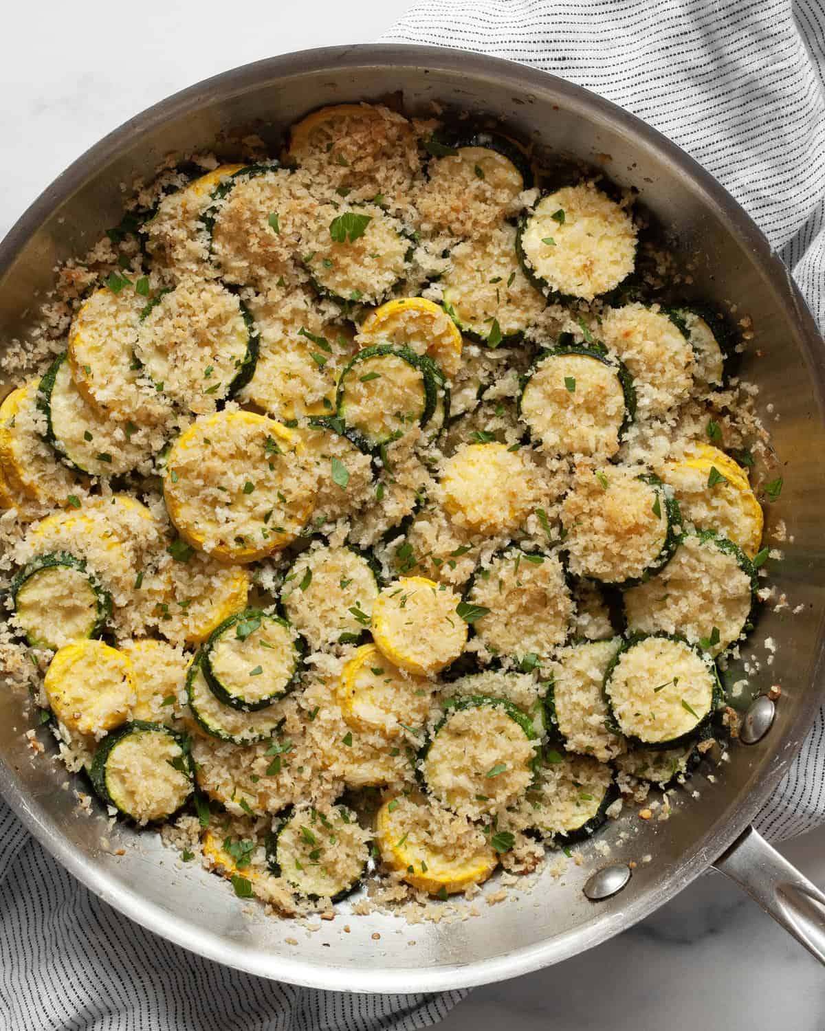 Zucchini and yellow squash casserole baked in a skillet.