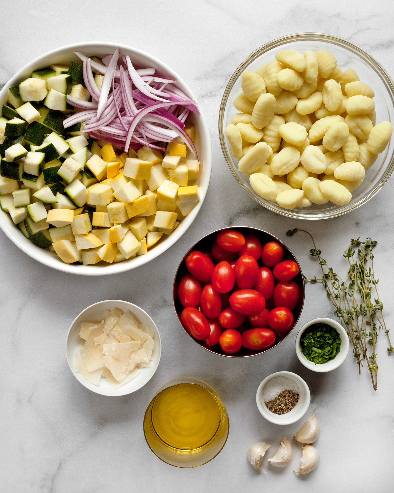 Ingredients including gnocchi, zucchini, squash and tomatoes