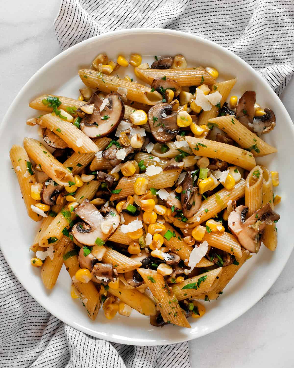 Mushroom corn pasta on a plate.