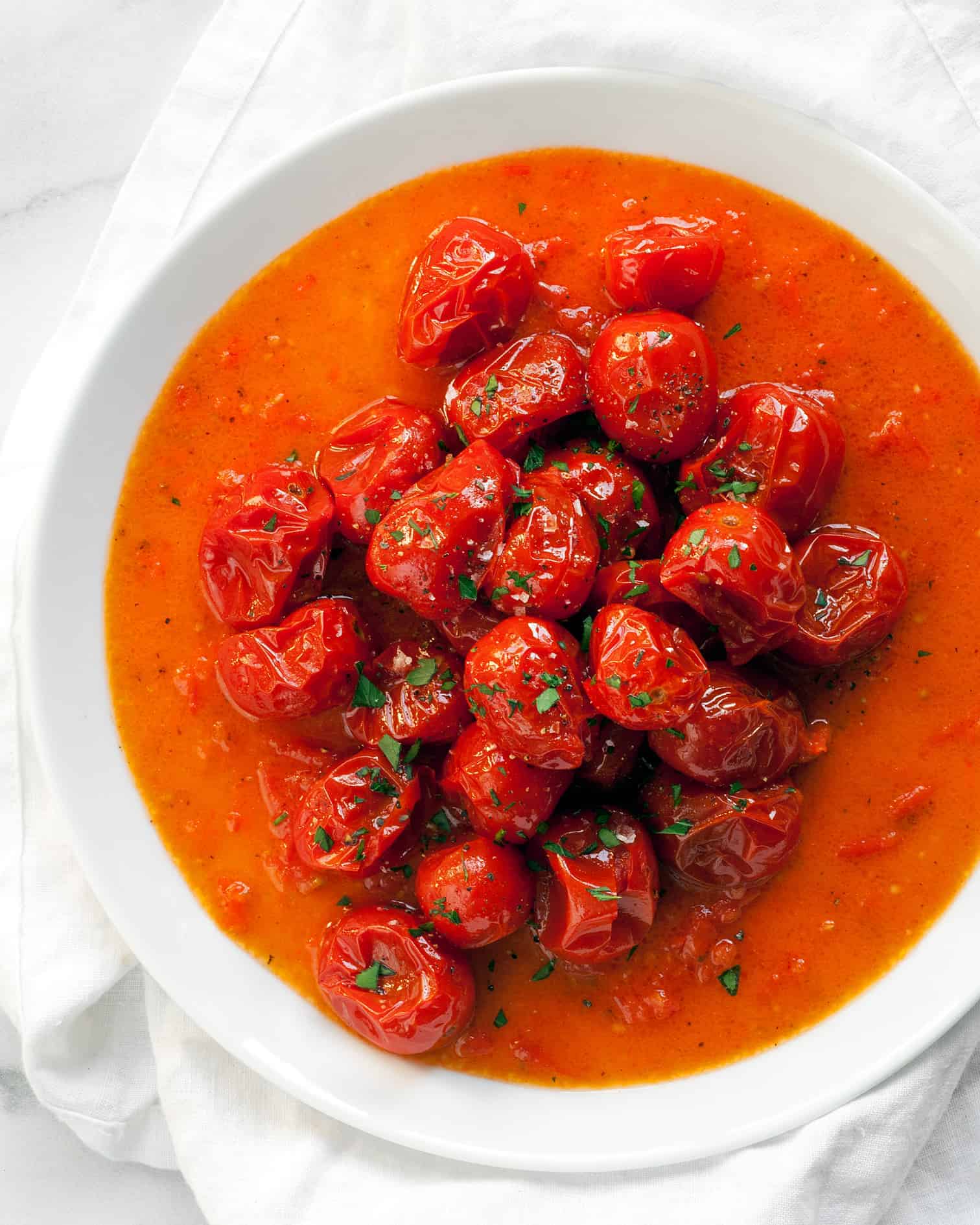 Cherry tomato vinaigrette on a plate.