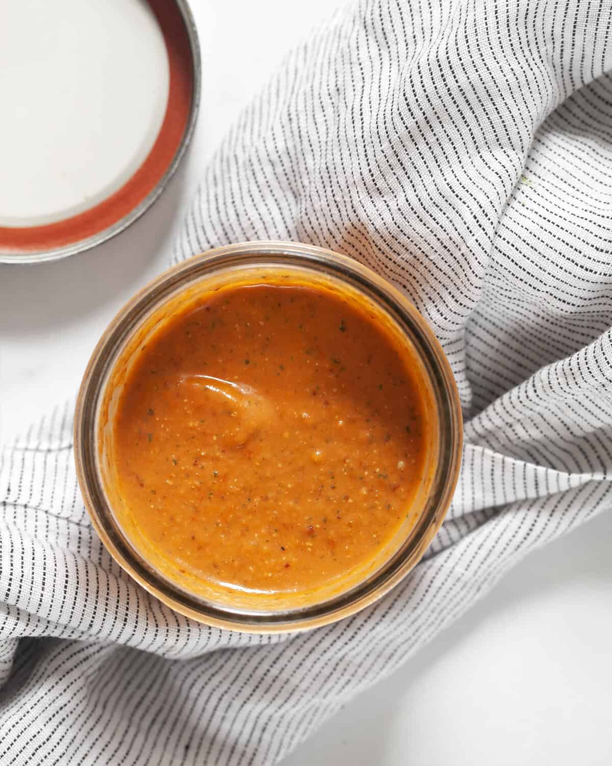 Roasted tomato vinaigrette in a jar.