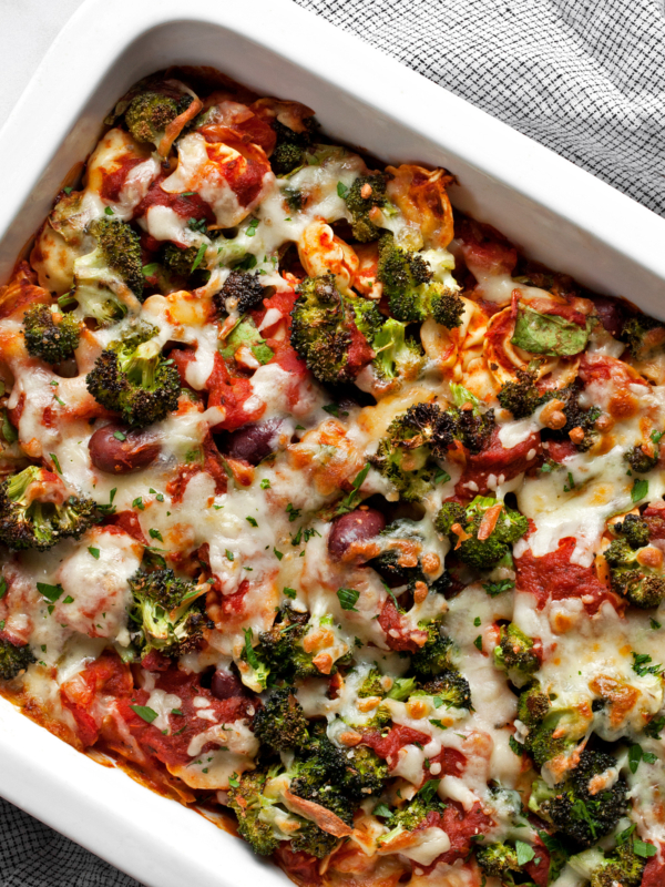 Vegetarian pasta bake with tortellini in a rectangular dish.