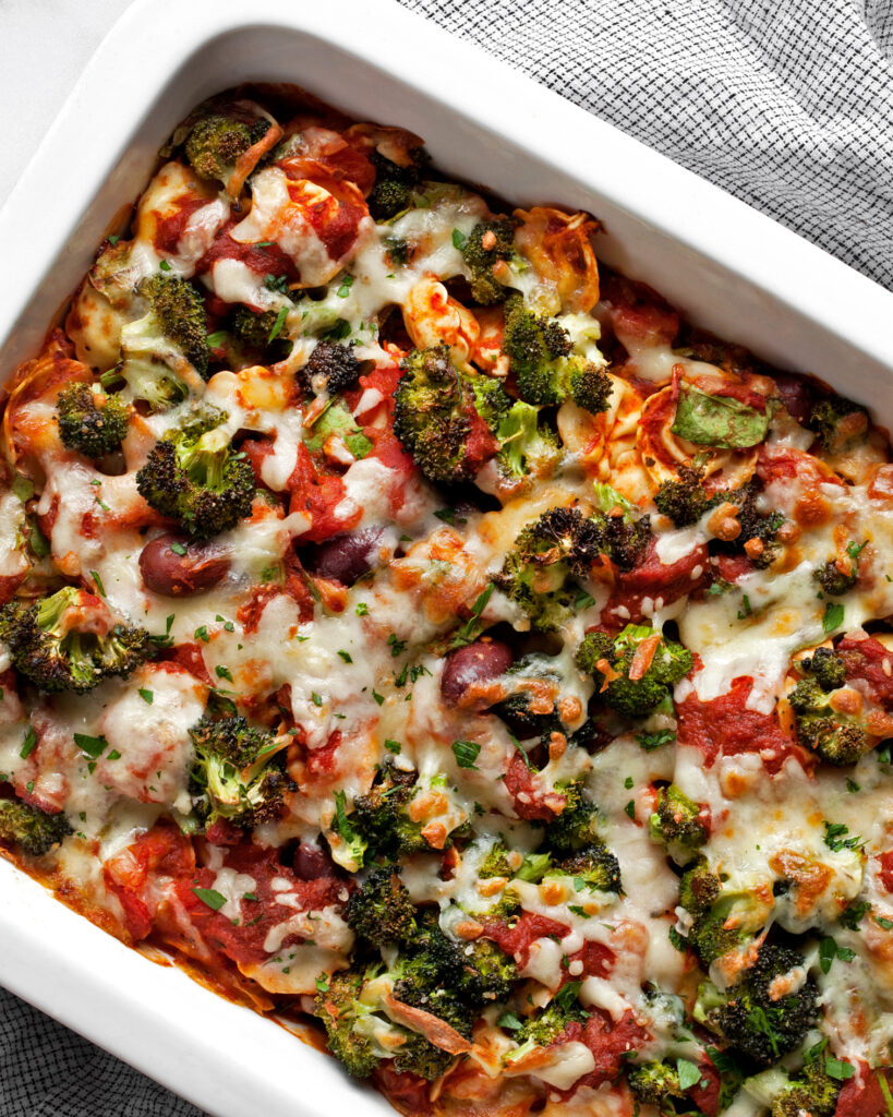 Vegetarian pasta bake with tortellini in a rectangular dish.