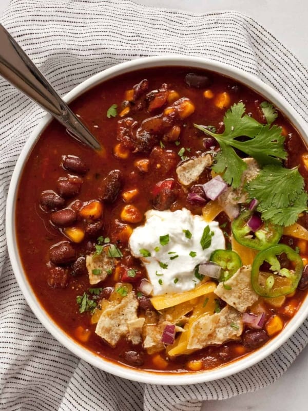 Bowl of chili with black beans, corn and tomatoes.