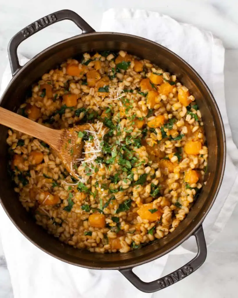 Stirring herbs into baked risotto