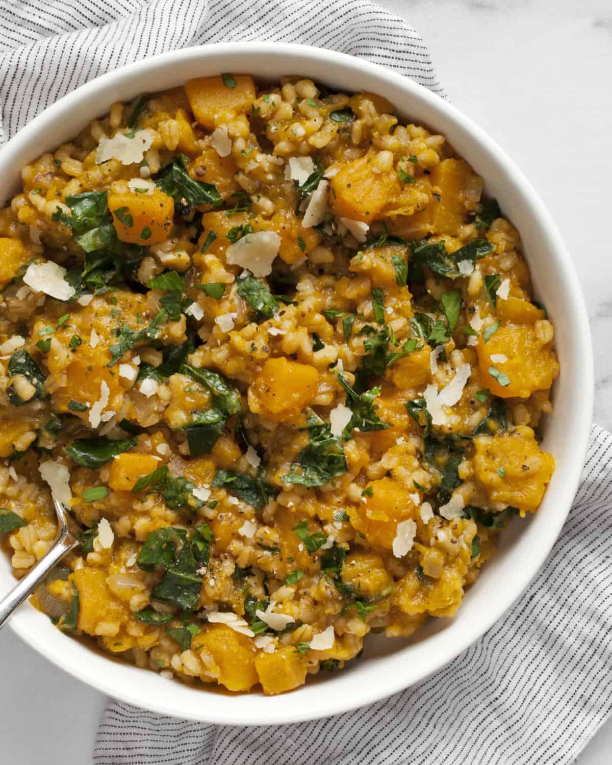 Baked butternut squash risotto in a bowl.