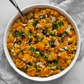 Baked butternut squash risotto in a bowl.
