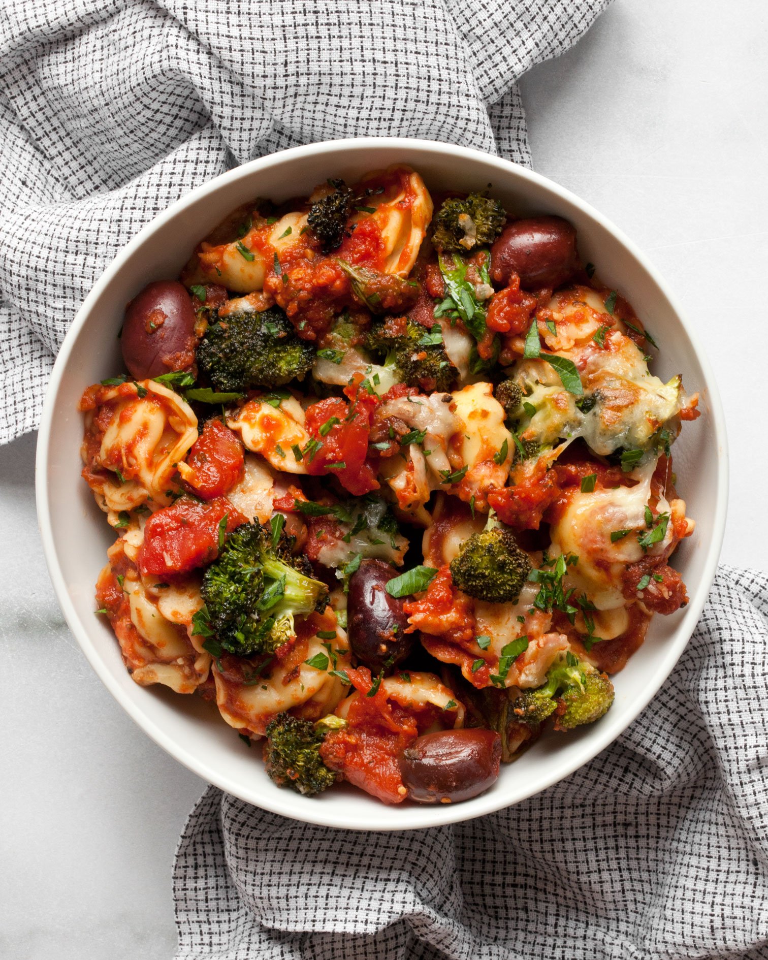 Baked tortellini in a serving bowl.