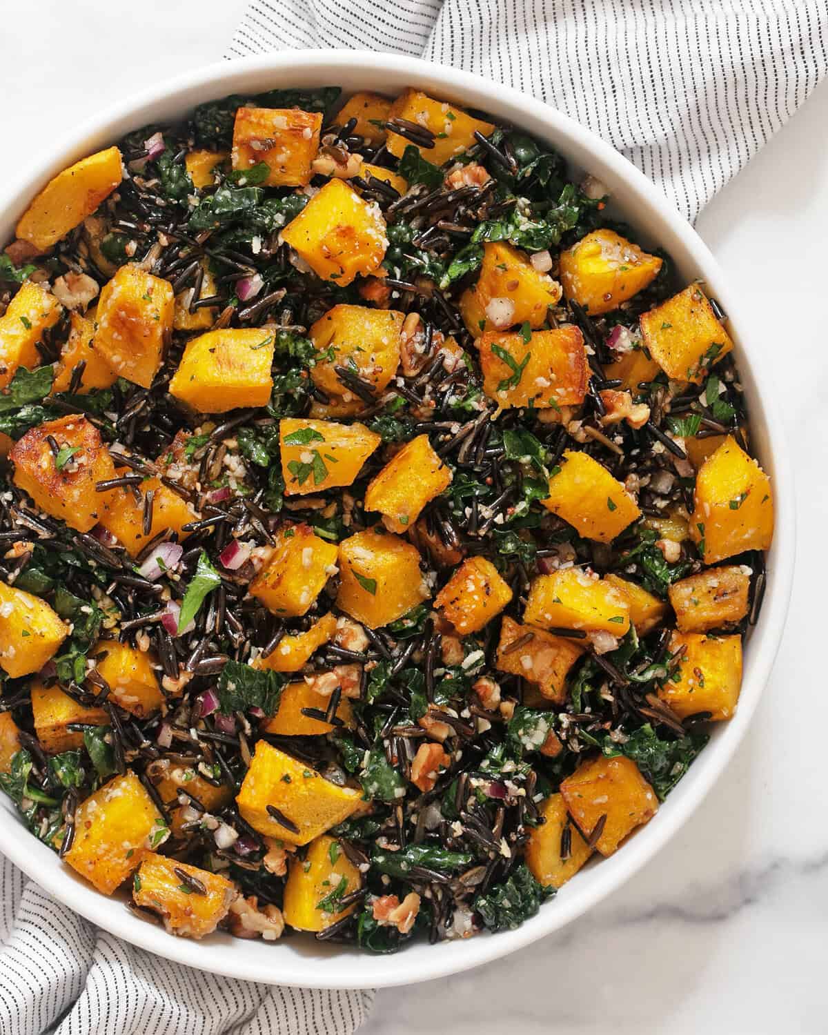 Roasted pumpkin wild rice salad in a bowl.