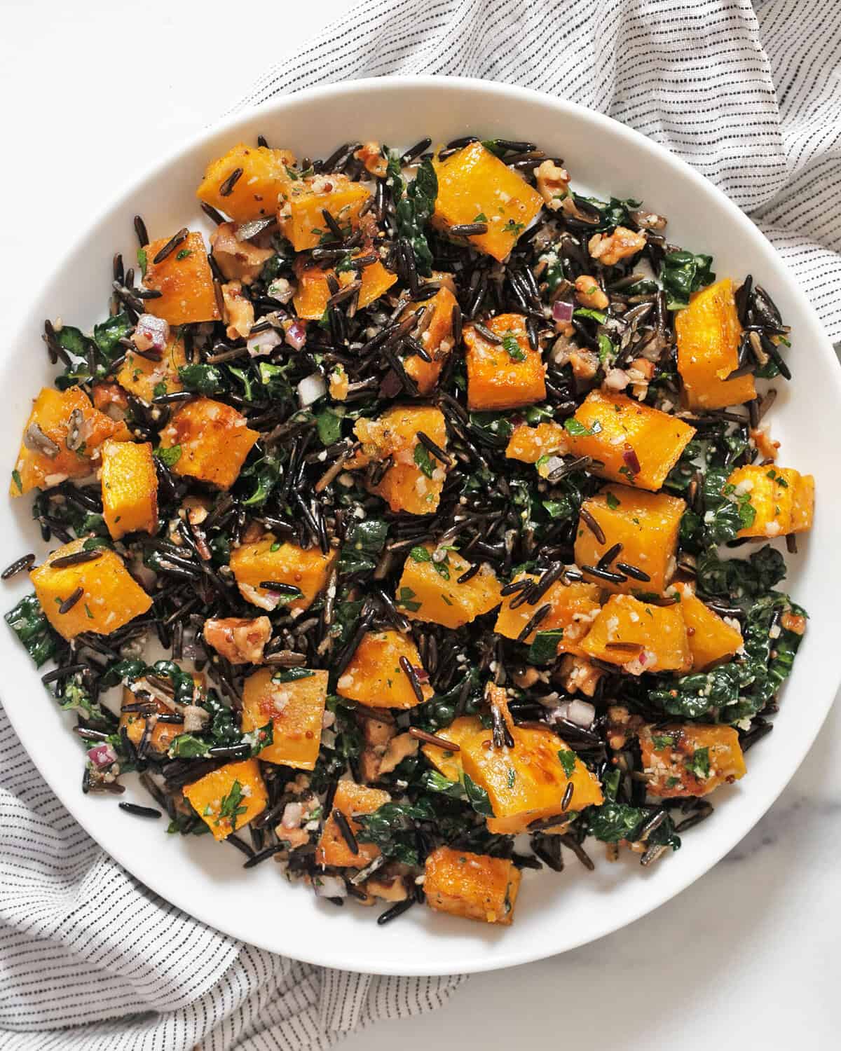 Roasted pumpkin wild rice salad on a plate.