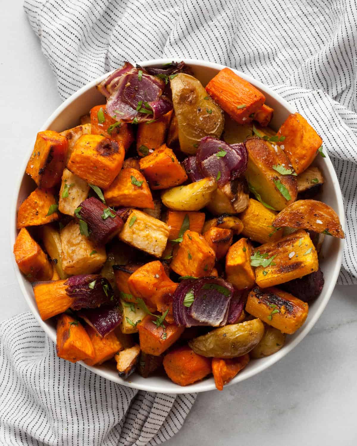 Roasted root vegetables in a bowl.