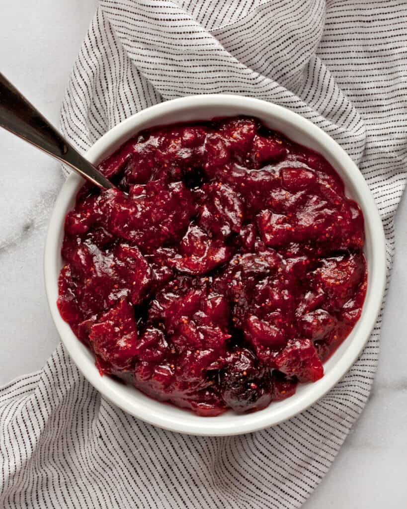 Small bowl with cranberry sauce.