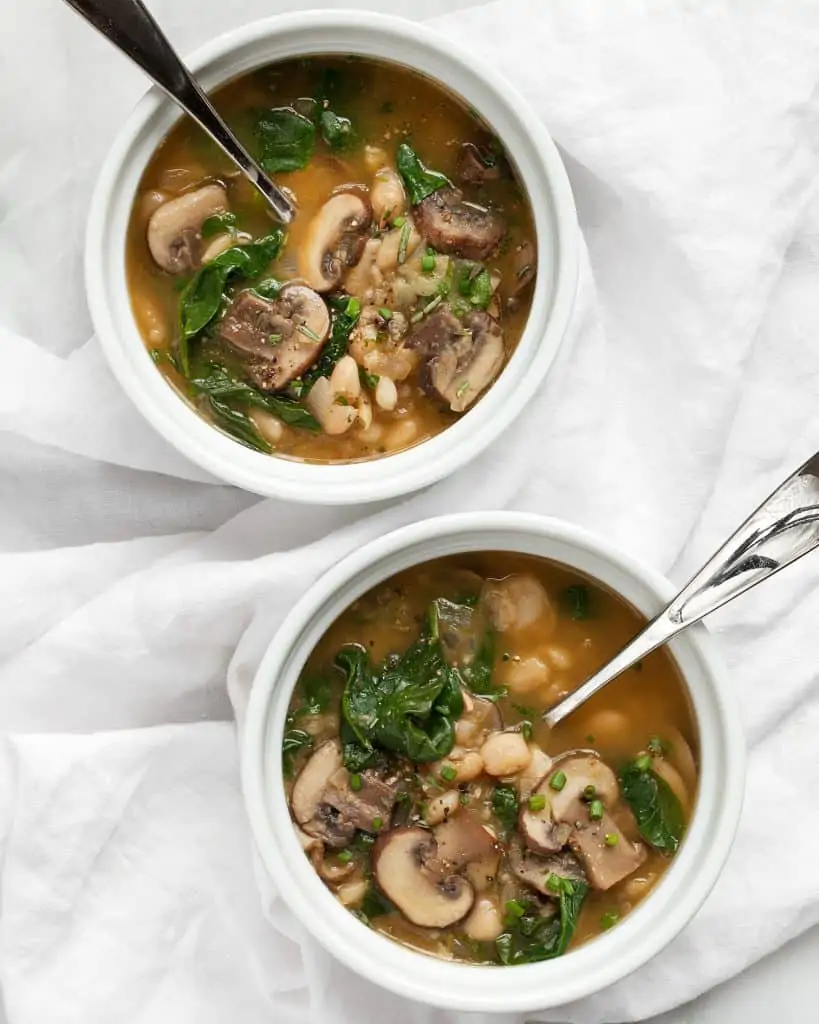 Mushroom soup with spinach and white beans
