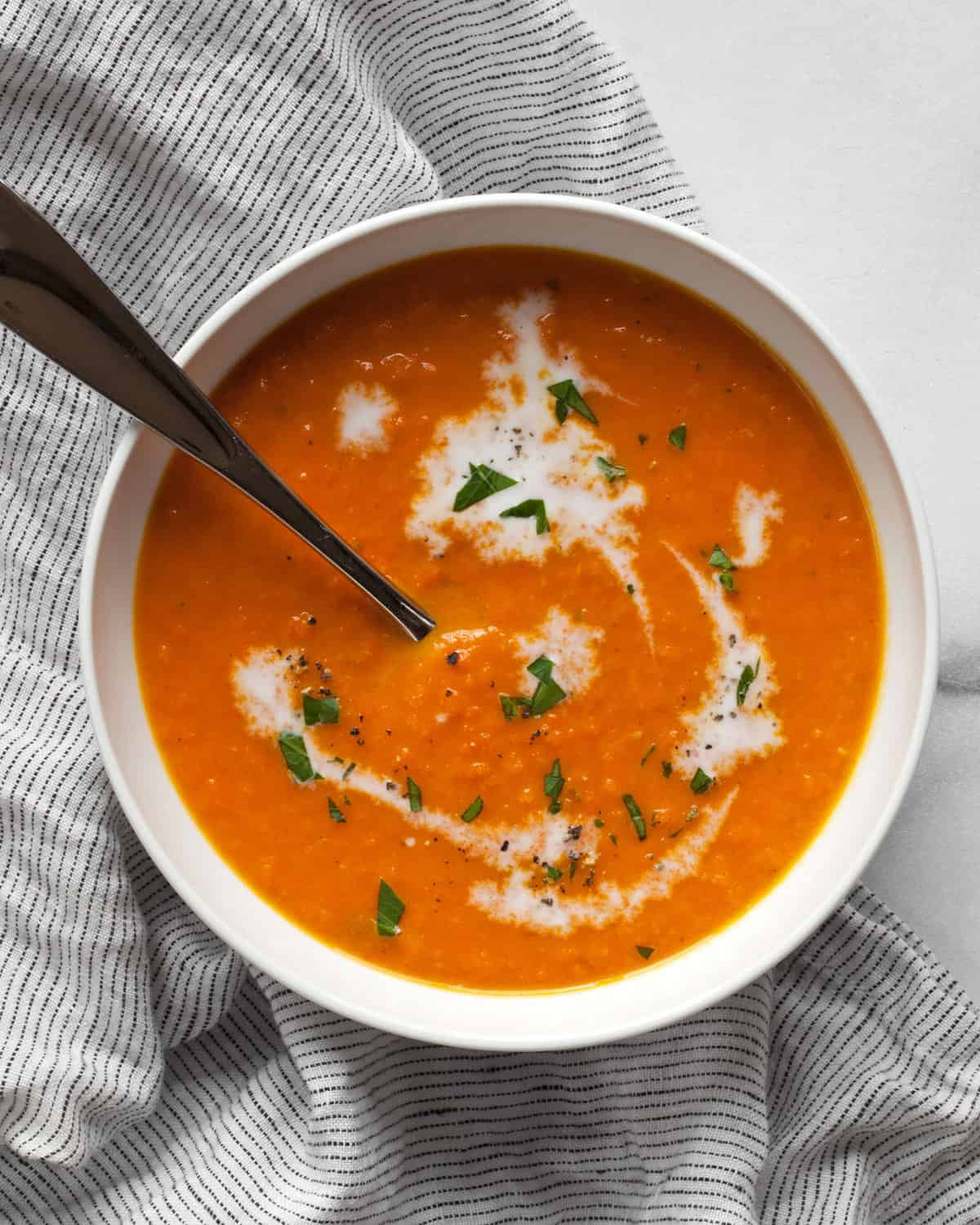 Vegan carrot ginger soup in a bowl.