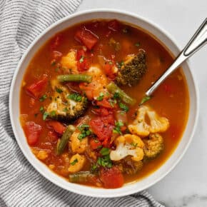 Vegetable soup with broccoli and cauliflower in a bowl.