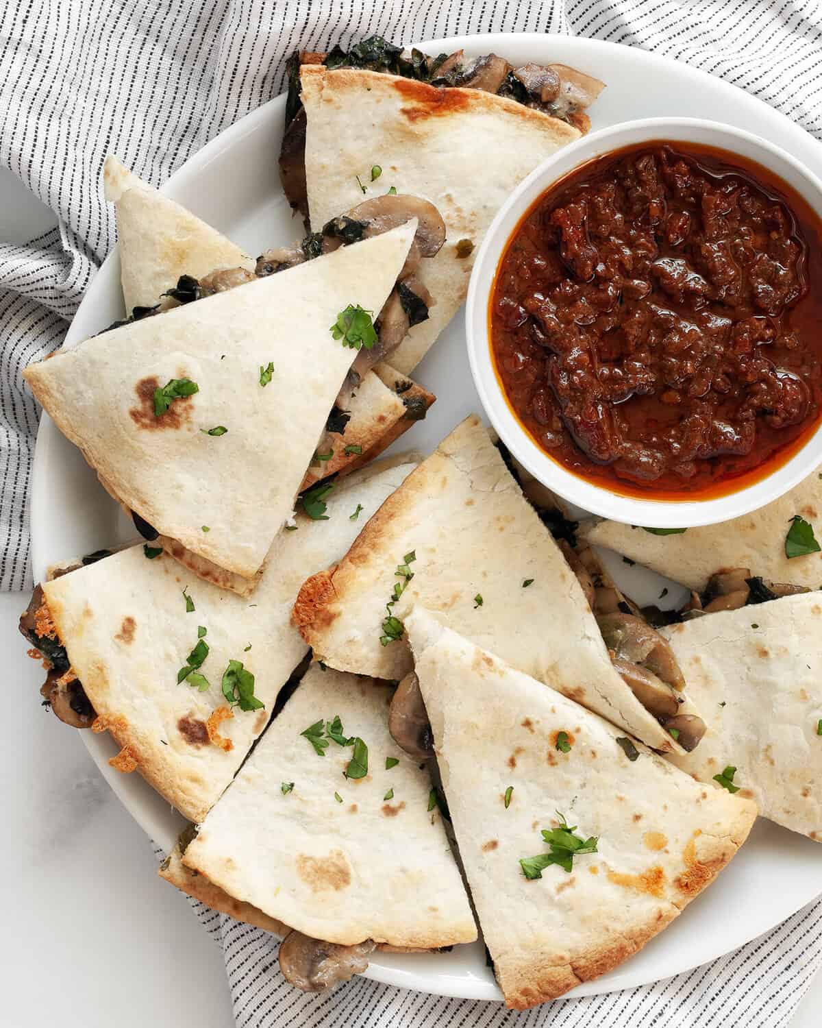 Easy baked mushroom kale quesadillas on a plate.