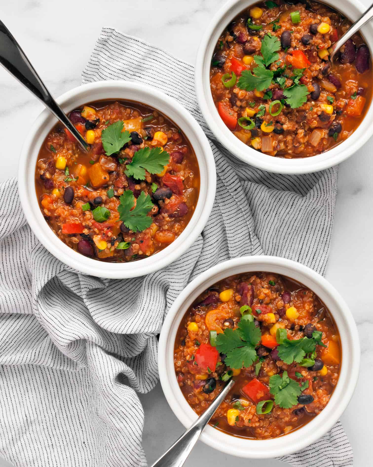 Three bowls of vegan chili.