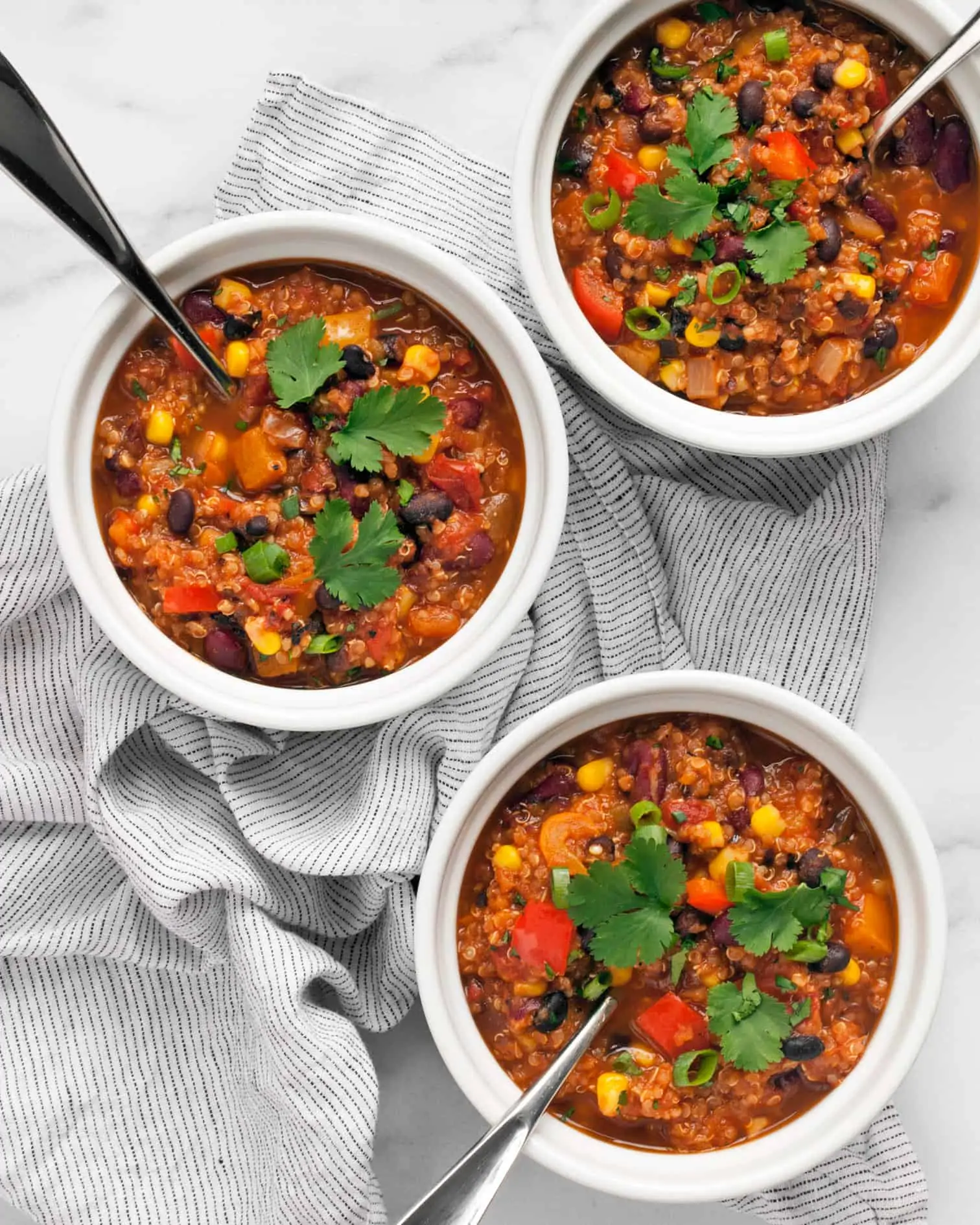 Three bowls of vegan chili.